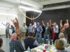 The men learning a Hawaiian dance